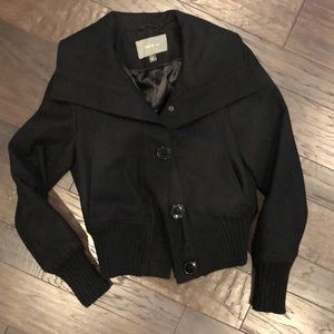 Black button up coat.